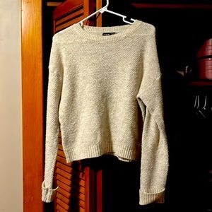Warm cream-colored sweater for winter